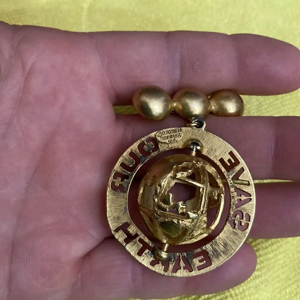 D torem renclif save our world vintage brooch